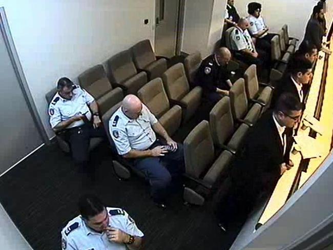 Moments before... Mumtaz Qaumi (third from camera, standing), brother of Brothers For Life Blacktown leader Farhad Qaumi, attacking his co-accused, Mohammed Kalal, with a pen during their trial. The motive for the attack remains unknown.