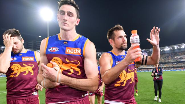 Luke Hodge (right) says goodbye after his last AFL game.