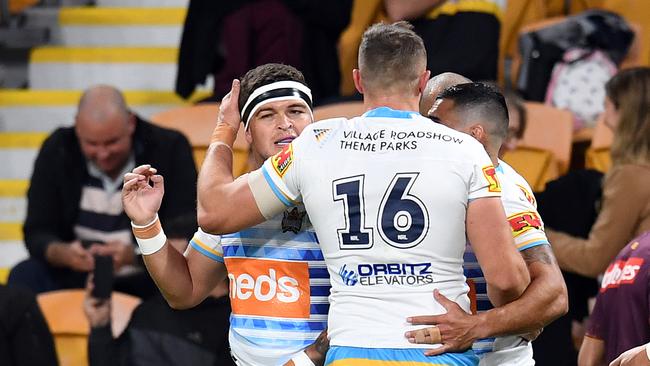 Ashley Taylor of the Titans celebrates a try during the Round 7 NRL match between the Brisbane Broncos and the Gold Coast Titans at Suncorp Stadium. (AAP Image/Dan Peled)