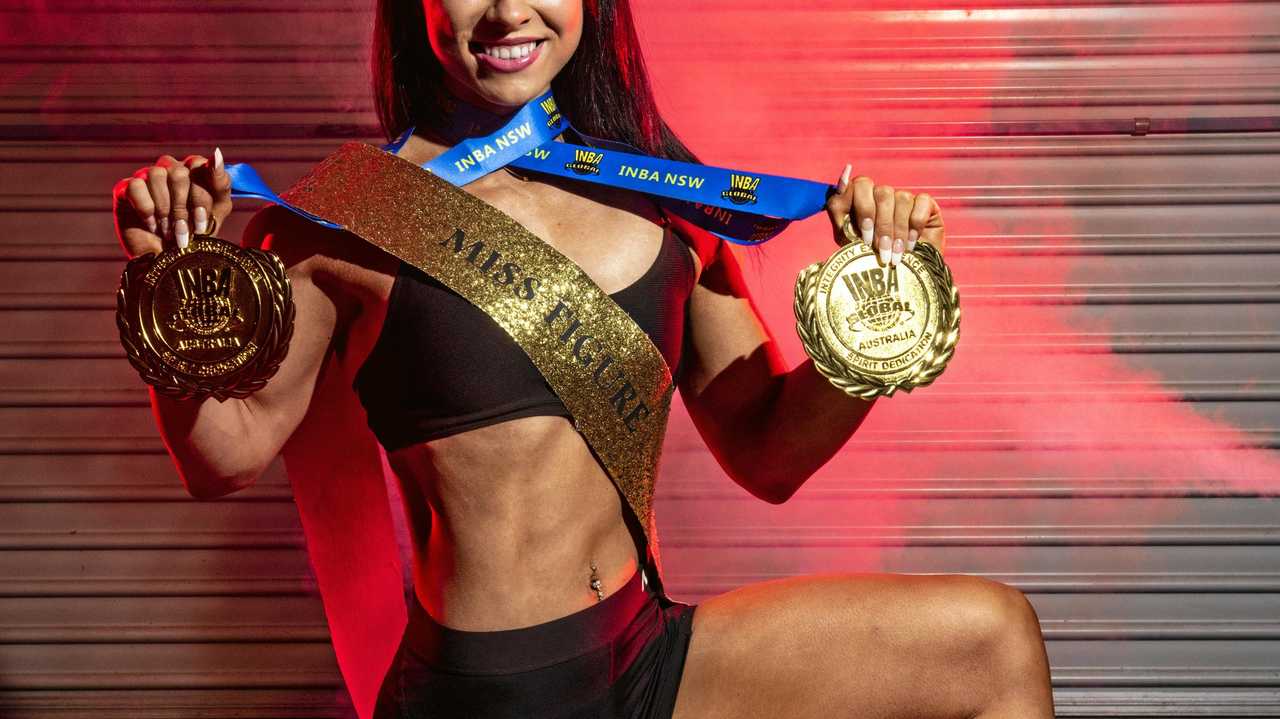 DRIPPING IN GOLD: Beccy Pateman with a swag of awards she won at INBA NSW State Titles. Picture: Adam Hourigan