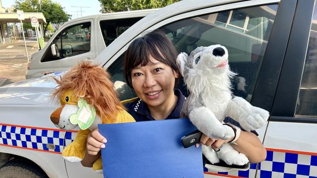 Cross-cultural senior police liaison officer Kayko Berry presented a five-year-old boy, who was stuck in the head in an alleged rock-throwing incident on Kuranda Scenic Rail, with two stuffed animals made by St Joseph's Outside Hours School Care. Picture: QPS