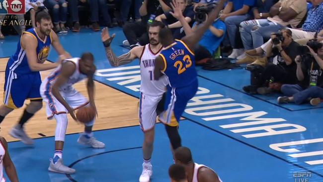 Draymond Green kicks Steven Adams in the groin.