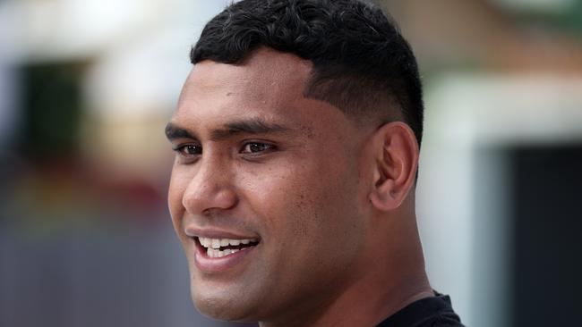 Tevita Pangai Junior outside Suncorp Stadium with the Wally Lewis statue, Milton. Picture: Liam Kidston