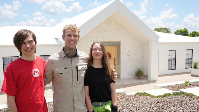 Toowoomba builder Colin Wilson's house Callista in Gowrie Junction has taken out the Master Builders' National Excellence in Building and Construction Award for best home in the $500,000 to $750,000 category. He's pictured with children Achilles and Harper.