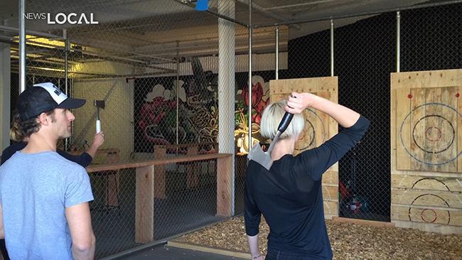 Inner West team tries axe throwing