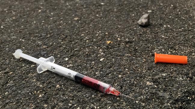 A blood filled needle in a laneway, Richmond. Picture: Nicole Garmston