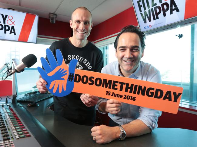 Dosomethingday2016. Nova FM personalities Fitzy and Wippa with the Dosomethingday sign at Nova in Pyrmont,. Picture: John Fotiadis