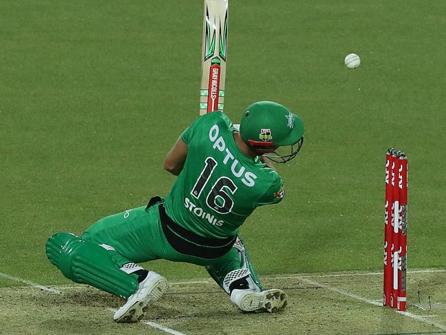 Marcus Stoinis is struck flush on the grill of his helmet by a delivery from Riley Meredith.