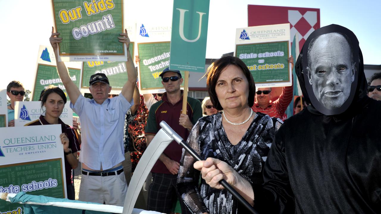 Then-NQ Teachers Union Representative Julieanne Gilbert and a teacher dressed as Campbell Newman's grim reaper in front of former Thuringowa MP Sam Cox's building rallying with teachers.