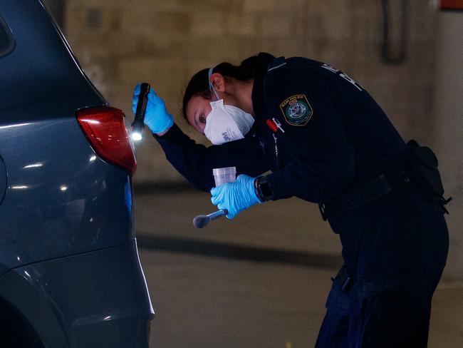 Police in the Crunch Fitness carpark after the attack. Picture: NCA NewsWire / Nikki Short