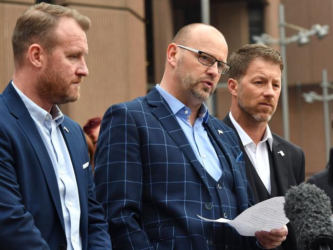 Abuse victims of former football coach Barry Bennell (L-R) Micky Fallon, Chris Unsworth and Steve Walters speak to the media after his sentencing.