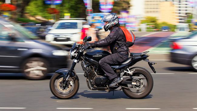 An Altona North man has died after his motorbike was struck by a reversing car.