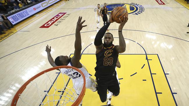 Cleveland Cavaliers forward LeBron James shoots against Golden State Warriors forward Draymond Green. Picture: AP