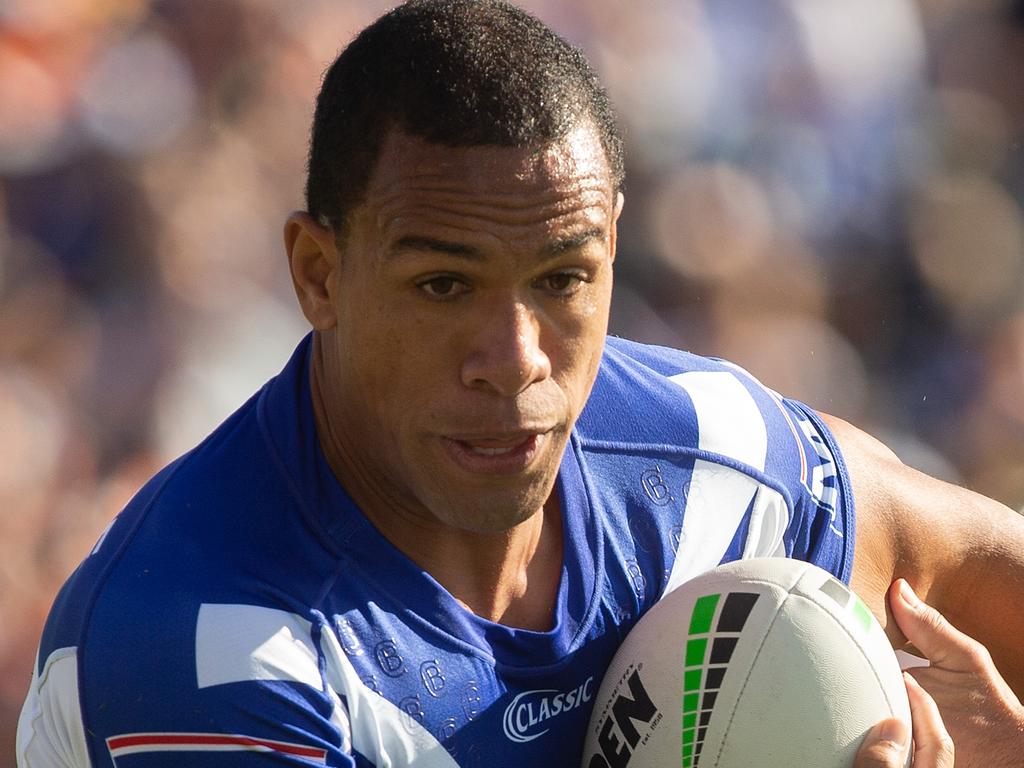 Bulldogs William Hopoate gets tackled by Tigers Corey Thompson during the Tigers and Canterbury Bulldogs round 3 match at Campbelltown Stadium, Sydney, Sunday, March 31, 2019. (AAP Image/Steve Christo) NO ARCHIVING, EDITORIAL USE ONLY