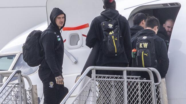 Richmond’s Dustin Martin boards a plane. Picture: Wayne Taylor.