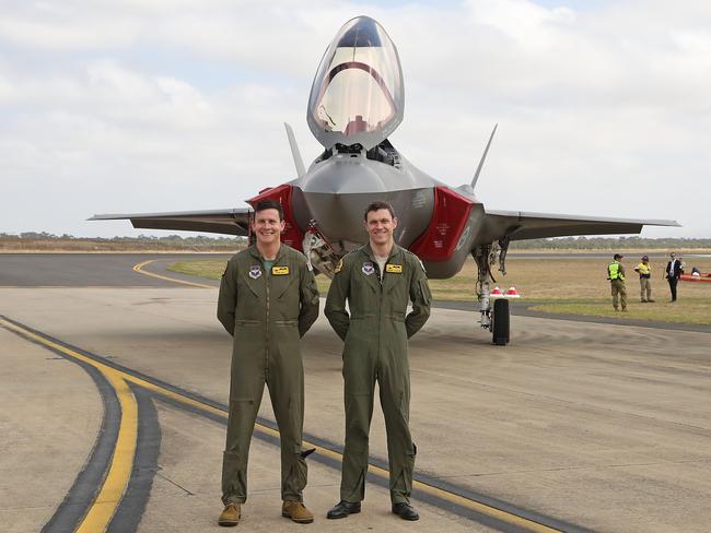 AVThe two pilots of Australia’s F-35s pose in front of the aircraft on March 3, 2017 during their public debut at the Avalon Air Show. Picture: Scott Barbour / Getty