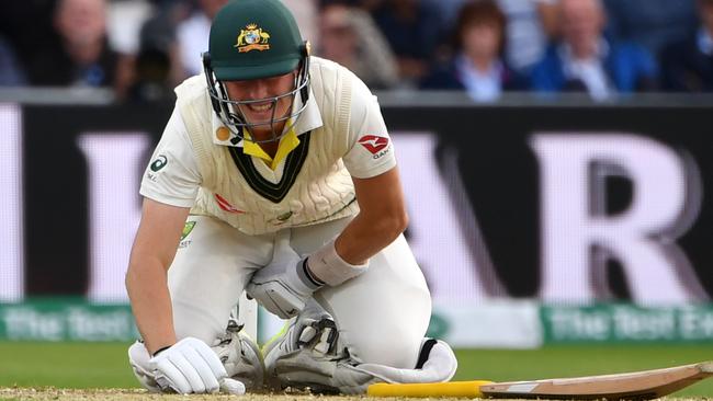 Australia's Marnus Labuschagne grimaces in pain after being hit by the ball on the first day of the third Ashes cricket Test match between England and Australia. Picture: Paul Ellis/AFP