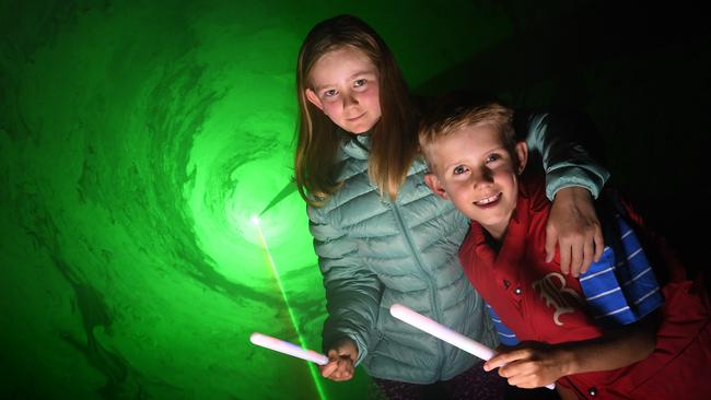 Bright sparks Jordan Cumberlidge, 10, and Jack Abbott, 9, get in on the laser action for City Lights as part of the Illuminate Adelaide winter festival. Picture: Tricia Watkinson