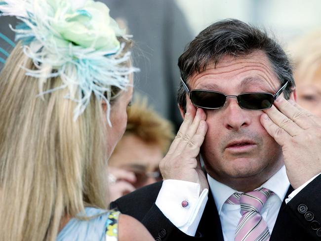 A shattered Lee Freedman wipes some tears after Mummify broke down in the 2005 Caulfield Cup.