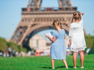 Adorable little girls in Paris background the Eiffel tower in France