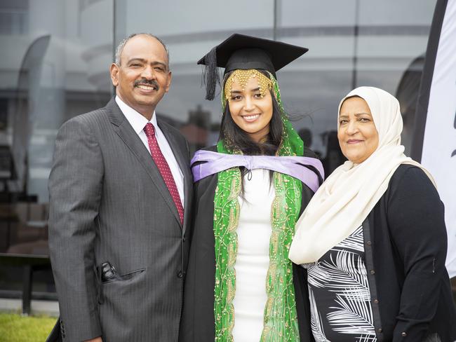 Satra Yusuf (centre) with Jamal and Rumia Yusuf. UTAS graduations. School of College of Health and Medicine Graduate Research. Picture: RICHARD JUPE