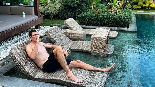 Mason Cox relaxes by the pool in Bali, declaring "no beef" after a post-game clash with Demons counterpart Christian Petracca. Picture: Instagram