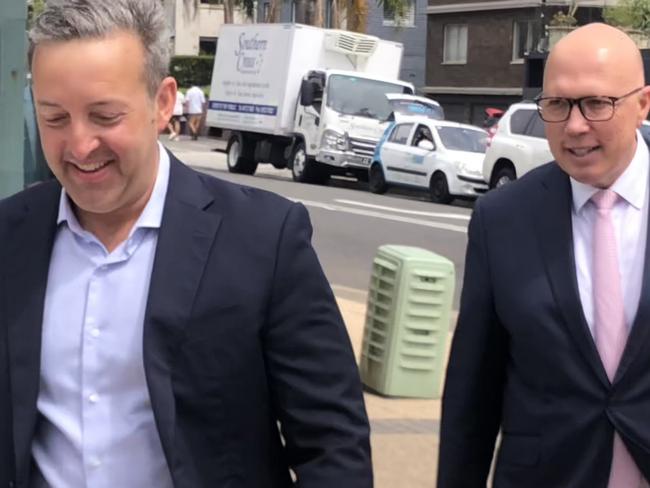 Mr Dutton arrives with Mackellar Liberal hopeful James Brown. Picture: Jim O’Rourke