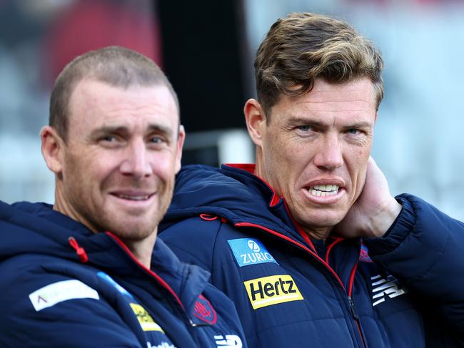 Jake Melksham (right), pictured with coach Simon Goodwin, has passed the final check to return from a ruptured ACL. Picture: Quinn Rooney/Getty Images