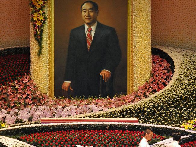 Unification Church honour guards carry the coffin (C) containing late Unification Church founder Sun Myung Moon during his funeral ceremony near Seoul. Picture: AFP