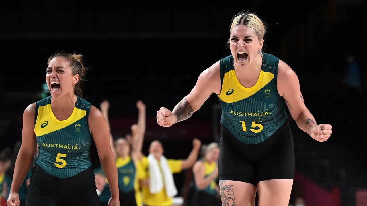 Leilani Mitchell and Cayla George celebrate Australia’s late escape from their group.