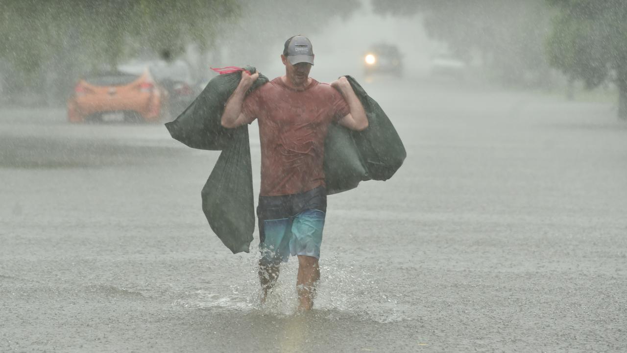 Peter Sharpe evacuates his home in Carmody Street, Rosslea, on Sunday. Picture: Evan Morgan