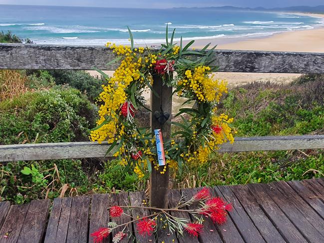 A wreath laid at Wilsons Headland where 15-year-old Mani Hart-Deville was killed by a shark while surfing with friends on Saturday, 11th July, 2020.