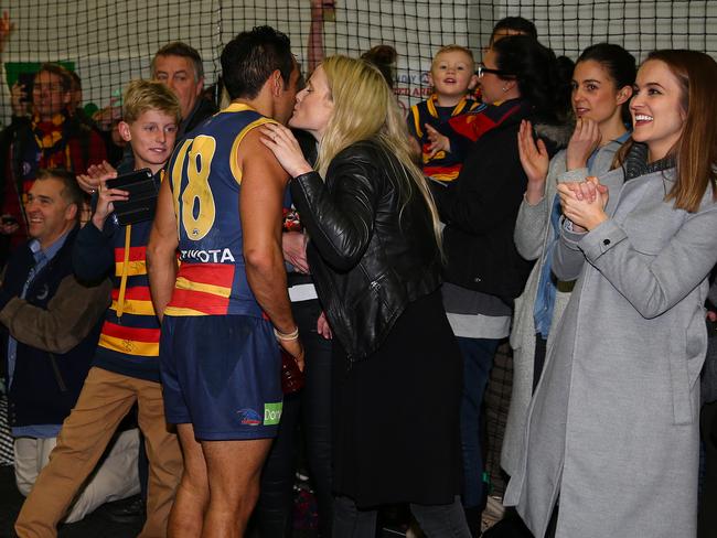 Eddie Betts receives a kiss from his wife Anna after the Crows win against Richmond in 2015. Picture: Sarah Reed.