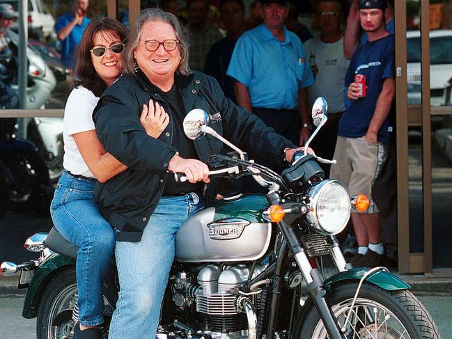 Doug Mulray and Lizzie take delivery of their new Triumph Bonneville in 2000. Picture: Peter Clark