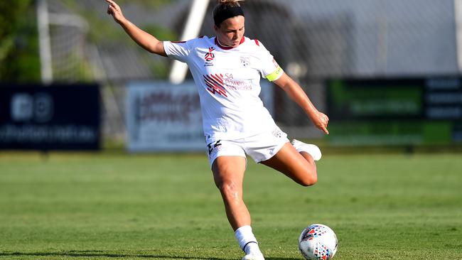 American defender Amber Brooks clears the ball during Adelaide United’s defeat to Brisbane Roar. Picture: Bradley Kanaris/Getty Images