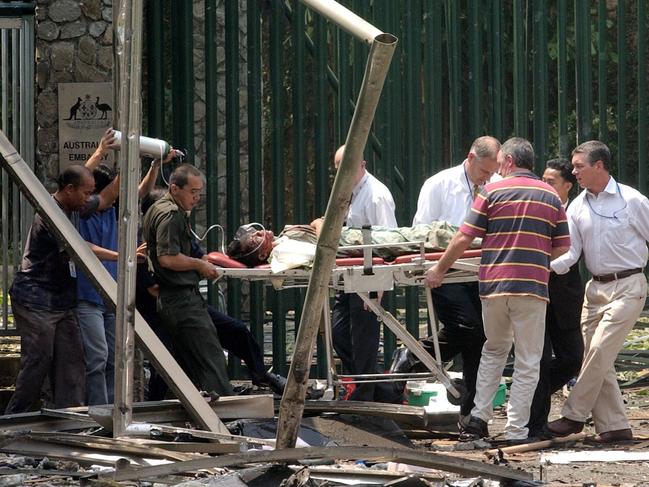 An injured person is carried out of the Australian Embassy on a stretcher, following a car bomb blast  Sept 09, 2004 in Jakarta, Indonesia. At least 11 people were killed and more than 100 were wounded. AP PicSuzanne/Plunkett   suicide bombing injured crime o/seas terrorism