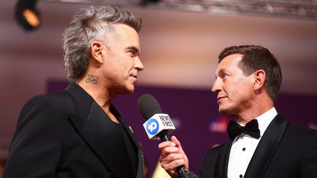 Robbie Williams and Rove McManus attend the 2025 AACTA Awards Presented By Foxtel Group at HOTA (Home of the Arts) (Photo by Chris Hyde/Getty Images for AFI)