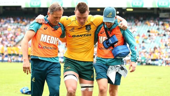 Wallaby Jack Dempsey is helped from field after being injured against the Barbarians in Sydney in October last year. Picture: Getty Images