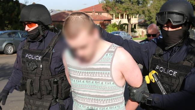 Police arrest the accused men. Picture: NSW Police