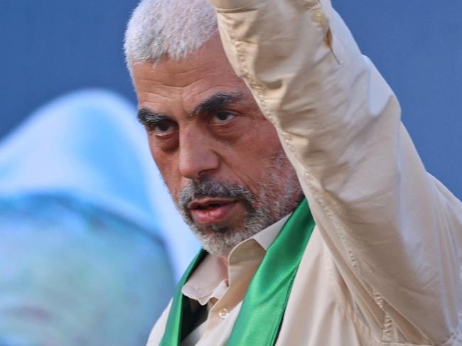 Yahya Sinwar, leader of the Palestinian Hamas movement, gestures on stage during a rally in Gaza City in 2021. Picture: AFP