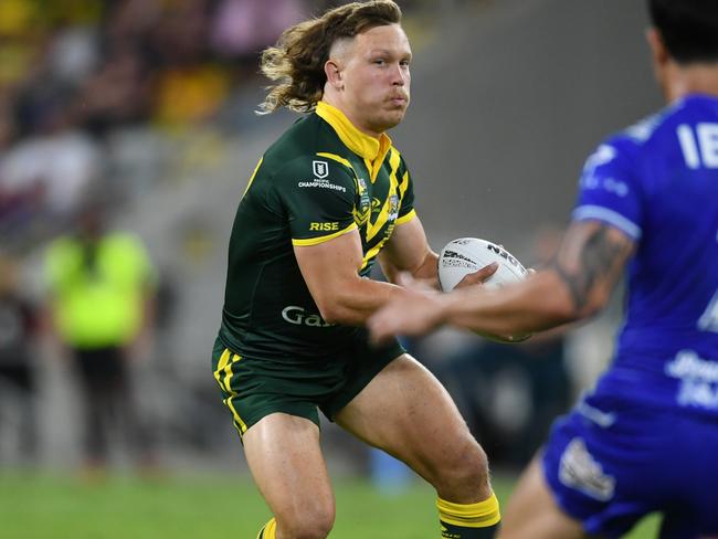 Reuben Cotter’s mullet bouncing in the green and gold against Samoa. Picture: NRL Imagery