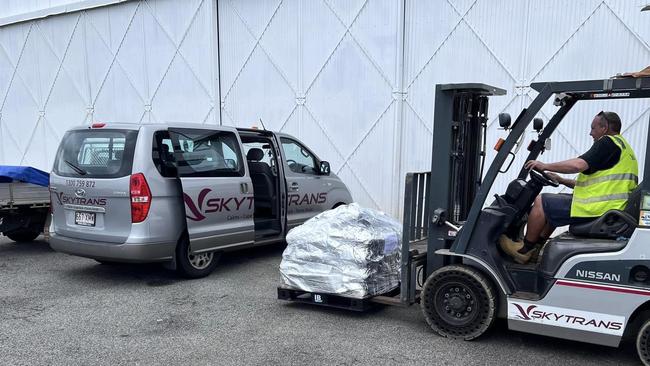 Skytrans team worked hard on Saturday to transported a load which will comprise their 2.8 tonnes of fresh food and supplies for Doomadgee some 990km west of Cairns after floodwaters cut roads. Picture: Supplied