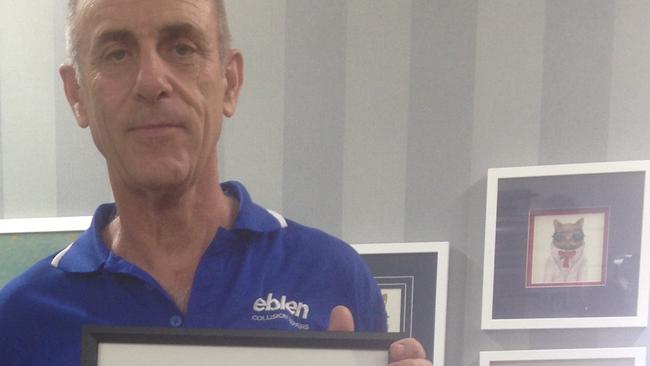 Peter Eblen with a framed apology from Holdfast Bay deputy mayor Mikki Bouchee.