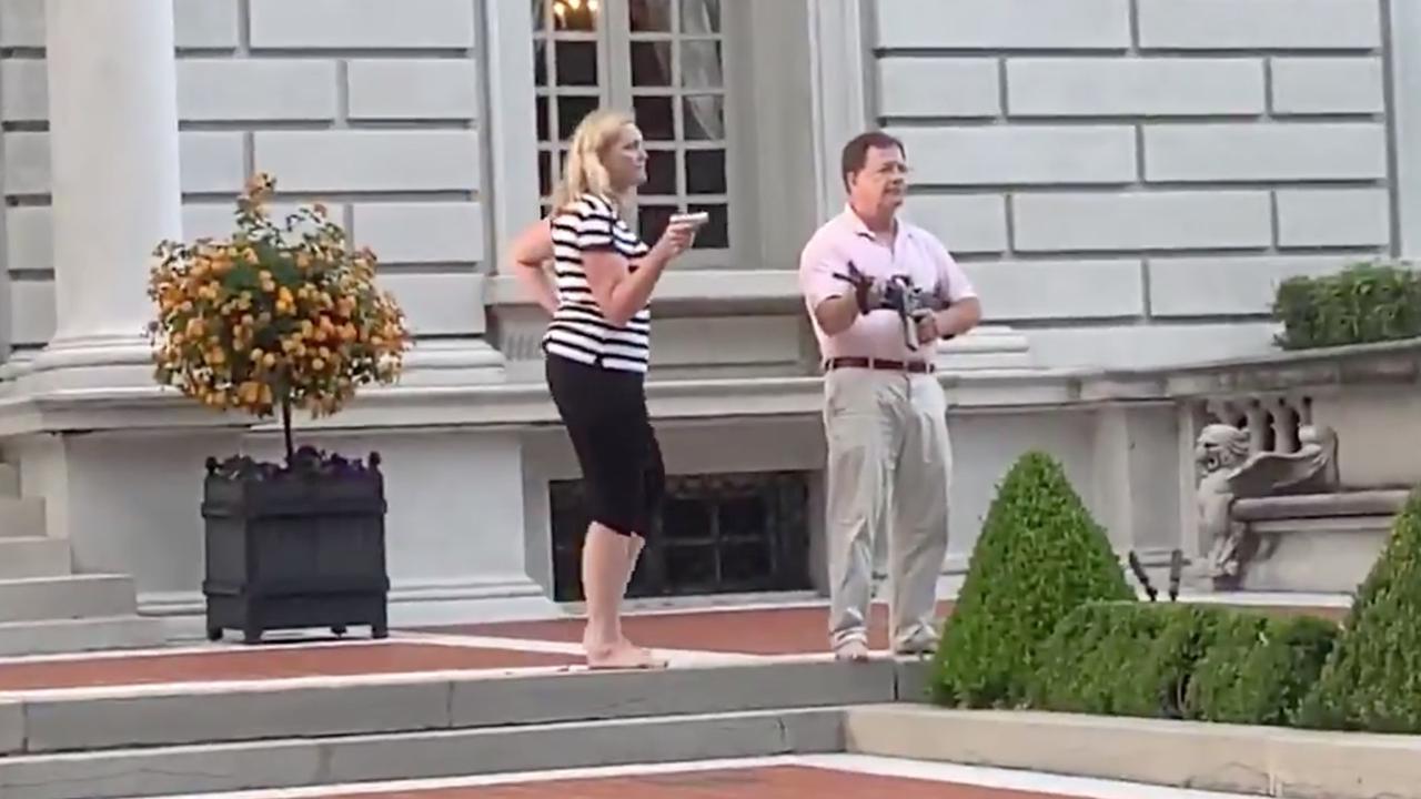 The couple were seen aiming guns at peaceful Black Lives Matter demonstrators. Picture: Daniel Schular/Twitter