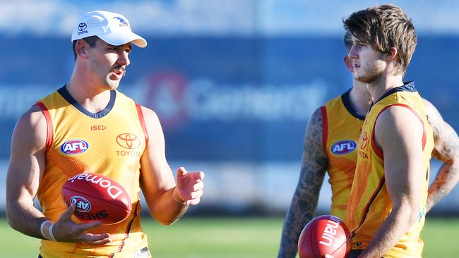 Taylor Walker speaks with his teammates during a training session. Picture: AAP Image/David Mariuz