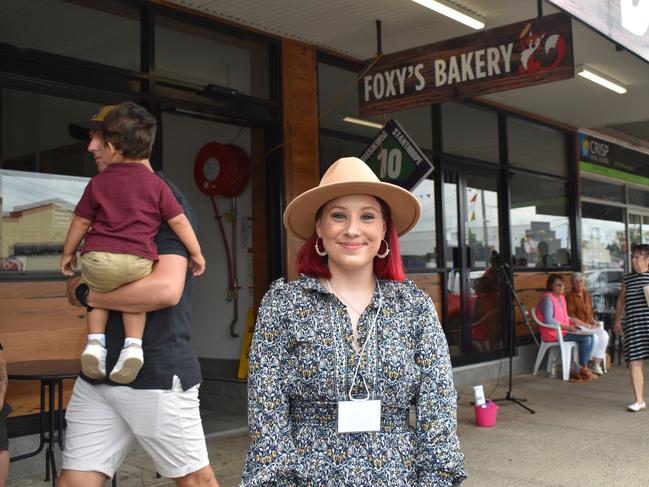 Brisbane musician Aria Cook enjoying the festivities at the Apple and Grape Festival 2024 despite the rain