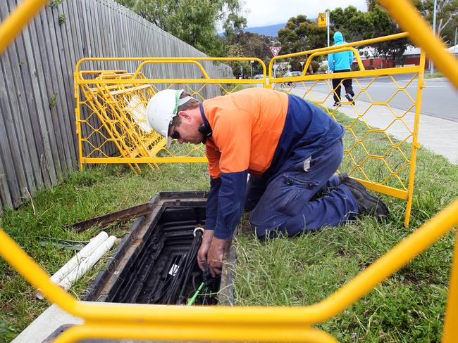 Tasmania�s NBN rollout. Visionstream has ramped up work and is now laying fibre in West Hobart, East Launceston and Rosny. picture of electrical contractors working in Warrane,