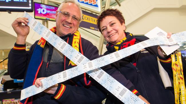 Jon and Leanne Sampson finally got their tickets in City Cross after waiting since about 5am. AAP Image/James Elsby.