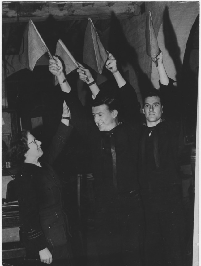 Mrs Mac instructing American naval personnel in semaphore. Picture: Australian War Memorial.