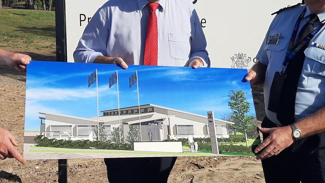 Assistant Commissioner Brian Wilkins, Police Minister Mark Ryan and Deputy Commissioner Doug Smith pose with the new design for a Pimpama police station on the Gold Coast, which is now fast-tracked to be completed November 2021. Photo: Brianna Morris-Grant